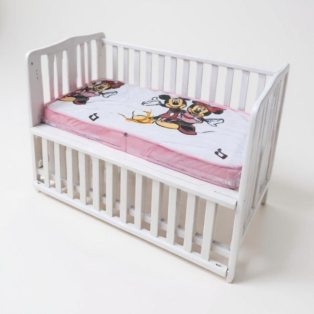 White foldable baby bed