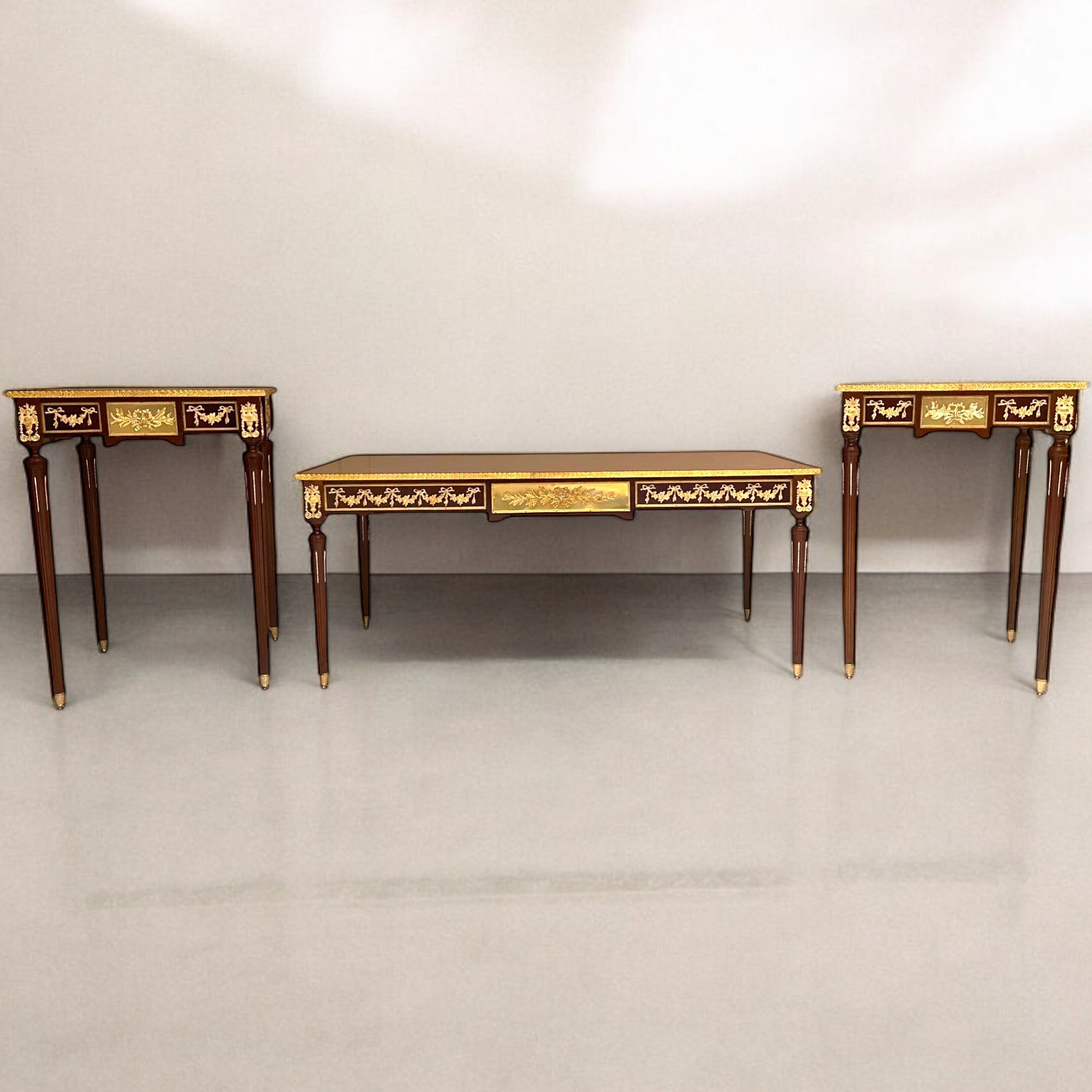 French table set consisting of a center table and two side tables