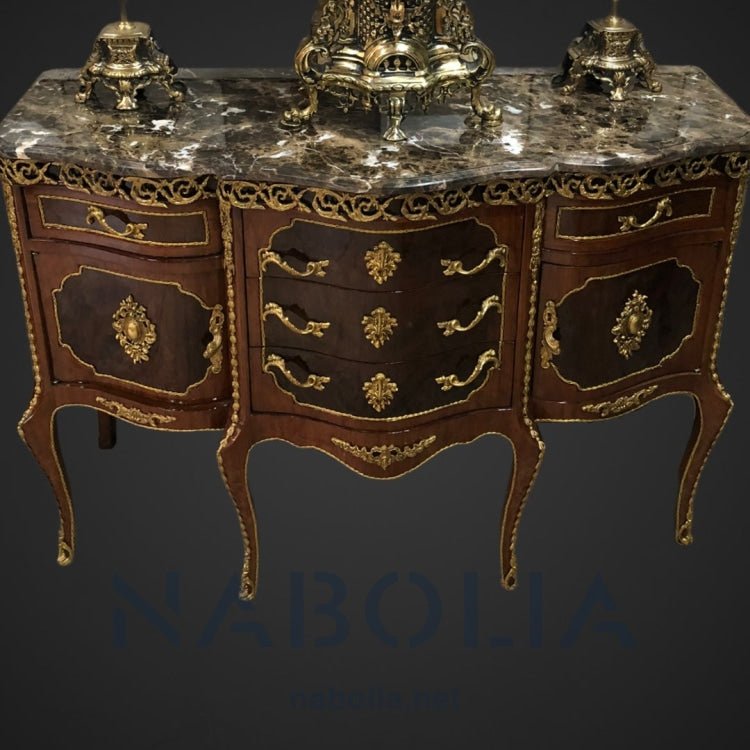 بايوه ستة ارجل -  بايوه ستة ارجل خمسة درج واتنين ضلفة من الخشب الطبيعي والرسم اليدوي ومطعم بالنحاس المشغول يدويا والرخام امبرادور غامق المقاسات: W 120 CM * L 90 CM