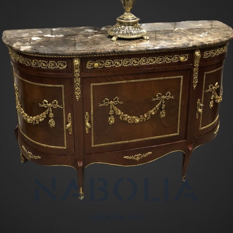 بايوه تلاتة ضلفة و درج -  بايوه من الخشب الطبيعي والقشرة الطبيعية تلاتة ضلفة و درج مطعم بالنحاس المشغول يدوياوالرخام امبرادور غامق المقاسات: W 155 CM * L 100 CM