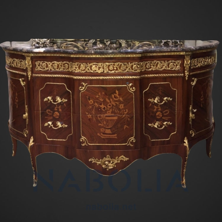 بوفيه بايوه تلاتة درج كبير و اتنين ضلفة -  بايوه تلاتة درج كبير و اتنين ضلفة من الخشب الطبيعي والقشرة المشغولة بالمارتكليه والمطعم بالنحاس المشغول يدويا والرخام امبرادور غامق المقاسات: W170 CM * L 100 CM