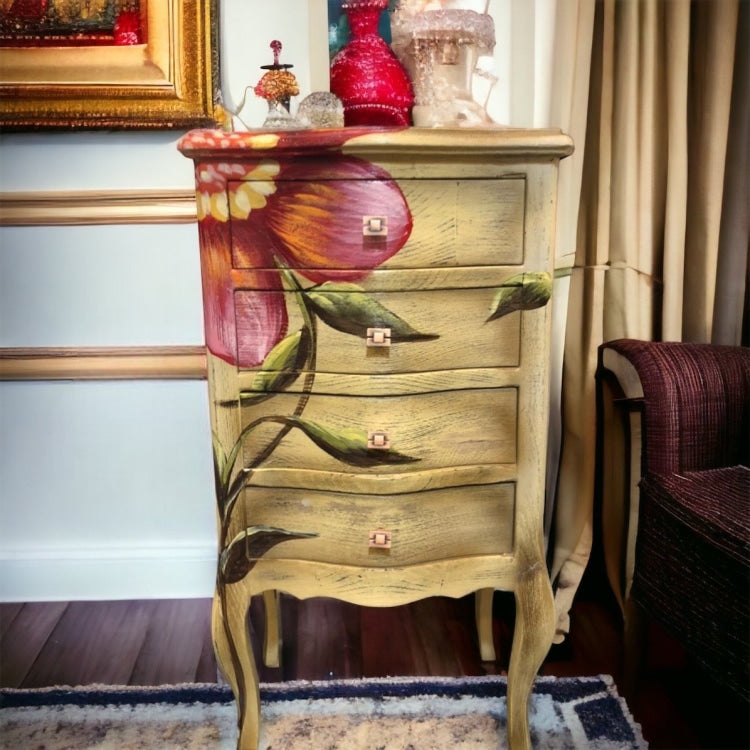 كمود أنتيك صغير برسم يدوي لزهرة كبيرة – 4 أدراج - قطعة فنية مبهجة بتصميم أنتيك رقيق، مصنوعة من خشب طبيعي عالي الجودة، ومشغولة بدهانات يدوية مختلفة بالكامل. الكمود مزود بـ4 أدراج بتصميم منحني ومقابض مربعة مميزة، وتُزين واجهته رسمة يدويّة لزهرة كبيرة تنساب بين الأدراج والأرجل، ما يضيف له لمسة ديكورية فريدة ومشرقة. الخامةخشب طبيعي – دهانات أنتيك – رسم يدوي المقاساتالعرض 40 سم × العمق 30 سم × الارتفاع 75 سم