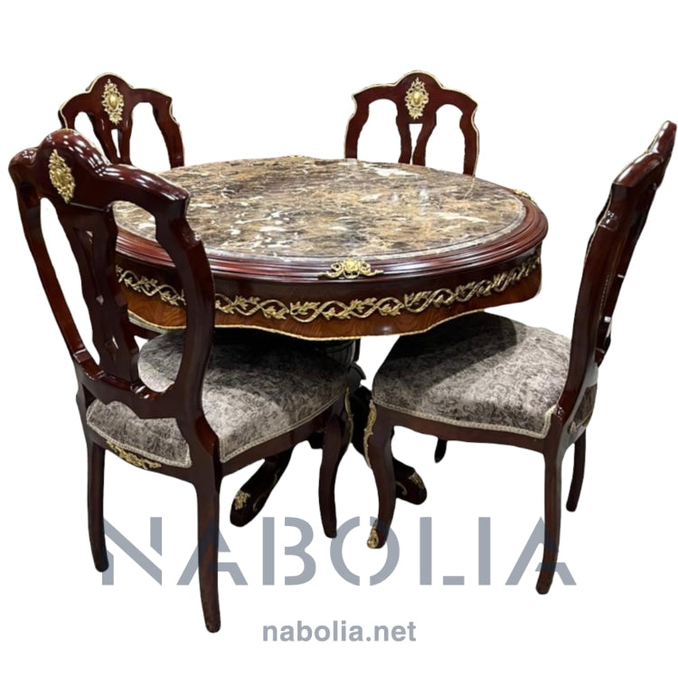 ترابيزة سفرة كلاسيك نحاس و اربعة كراسي - ترابيزة سفرة و اربعة كراسي من الخشب الزان و مطعمة بالنحاس المشغول يدويا المقاسات: قطر الترابيزة 120 CM