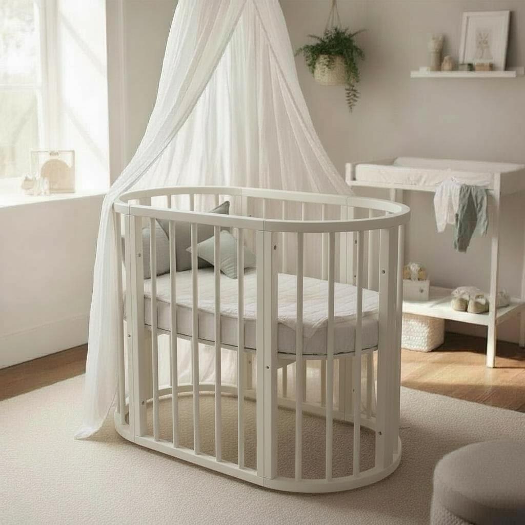 سرير أطفال بيضاوي خشبي بتصميم ناعم وآمن