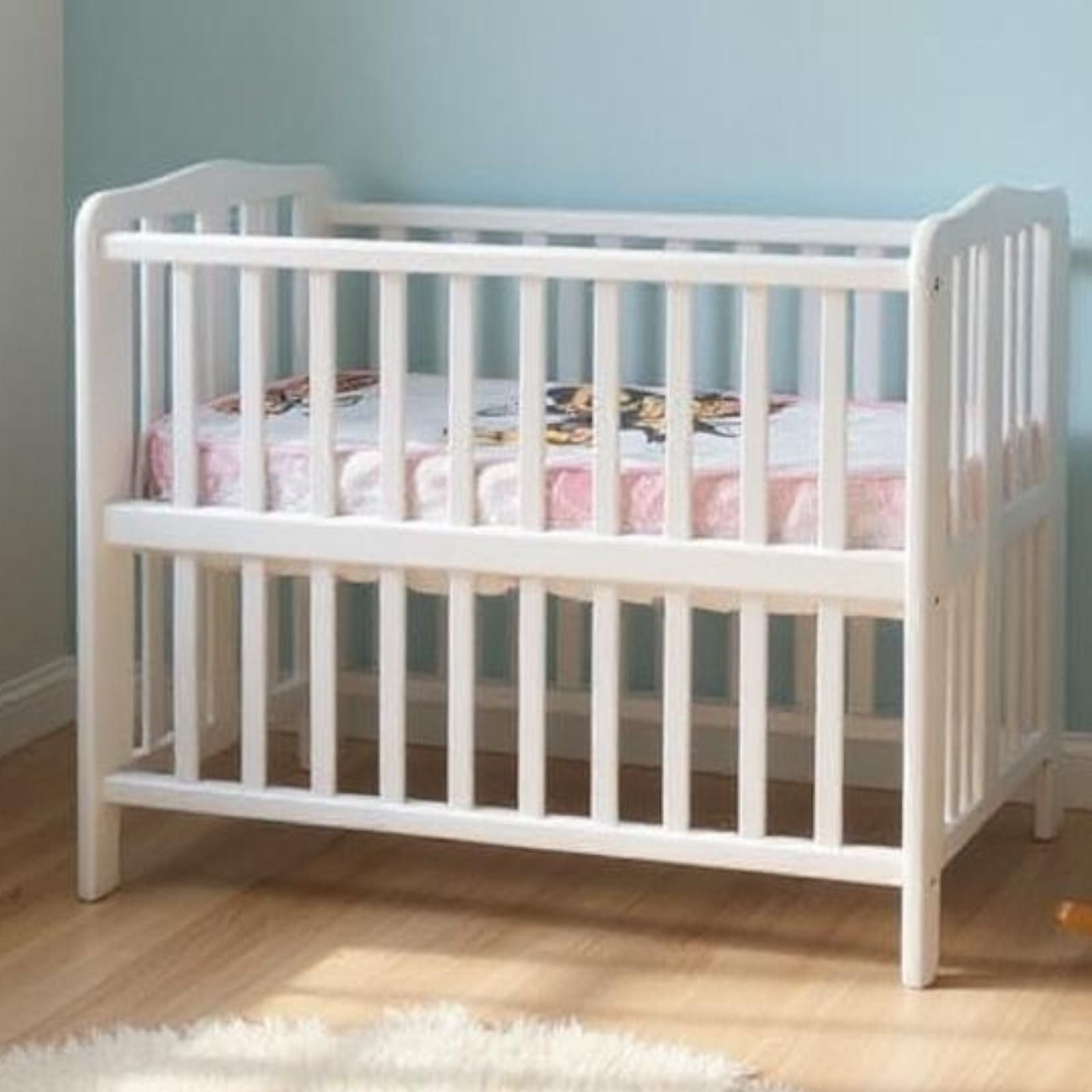 White foldable baby bed